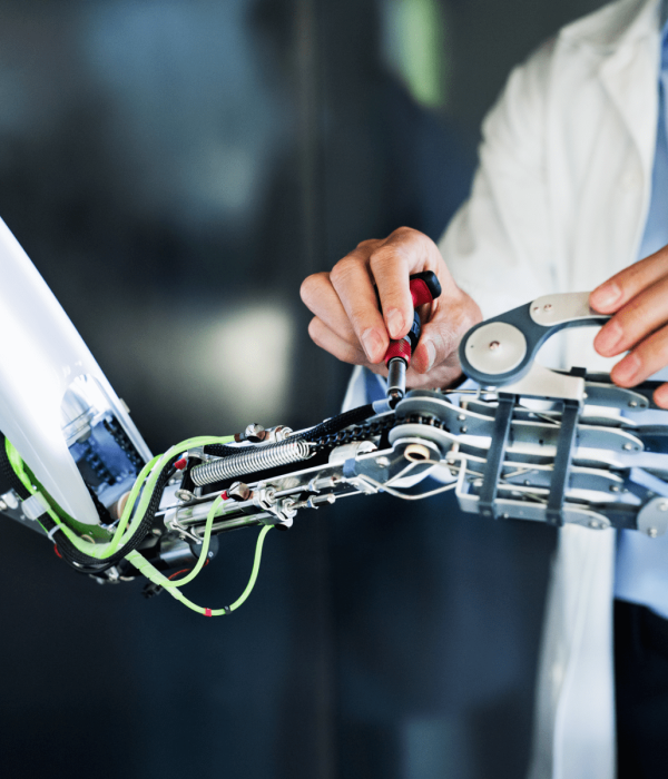 unrecognizable-scientist-with-a-robot-PWVDE8M